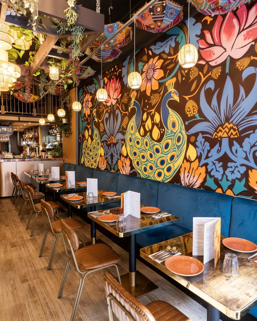 Nutmeg's dining room, with a painted peacock mural