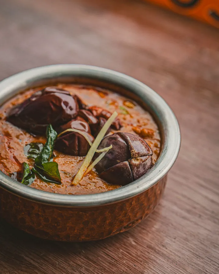 Baby aubergines in a red curry with ginger and curry leaves