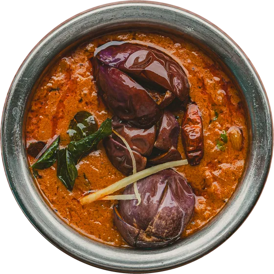 Baby aubergines in a red curry, in a steel bowl