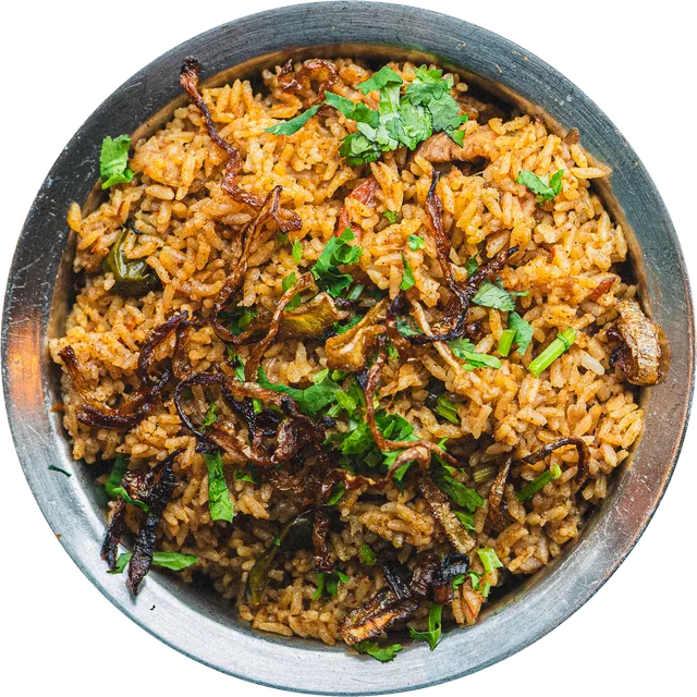 Dindigul chicken biriyani in a steel bowl, topped with fried onions and coriander